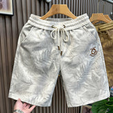 European high-end fashion heavy industry embroidery casual sports shorts men's trendy brand 2026 summer new beach five quarter pants