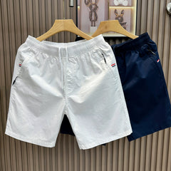 2026 new slim fit casual white shorts for men in summer, thin and loose five quarter pants, mid length pants for men, trendy and high-end