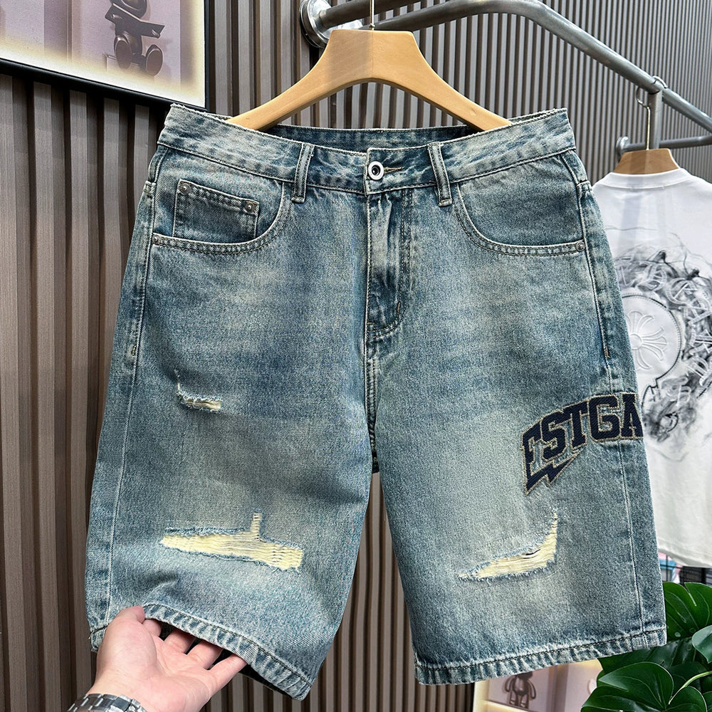 Patched ripped denim shorts for men in summer 2026, thin, American retro embroidered mid length, loose straight leg cropped pants